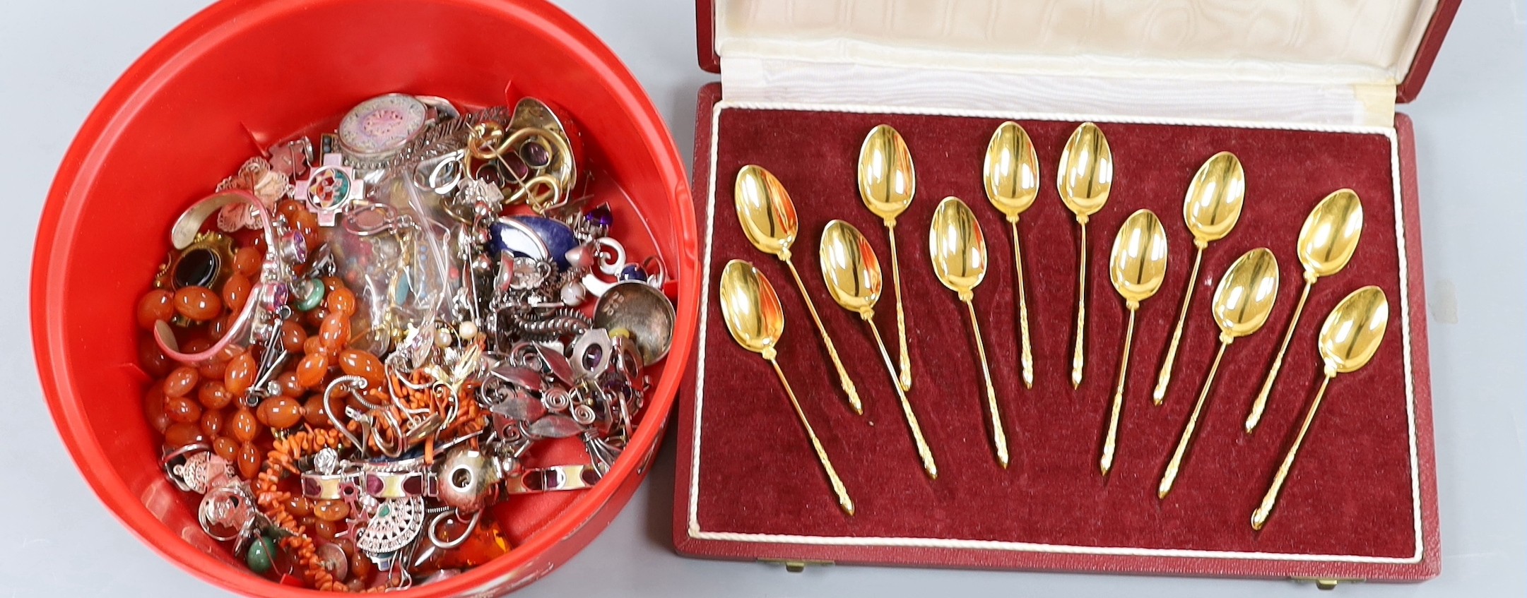 Assorted jewellery including enamelled silver bracelet, other white metal items, costume jewellery, agate necklace and a cased set of French gilt spoons.